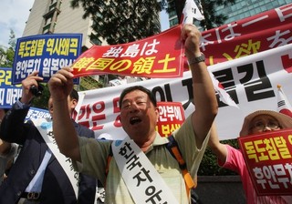 North Korea Smiles While Asia Feuds