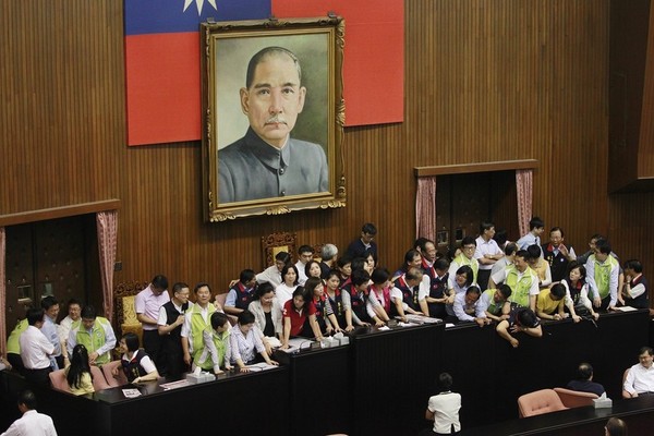 In China, Mideast Sparks Debate on Democracy