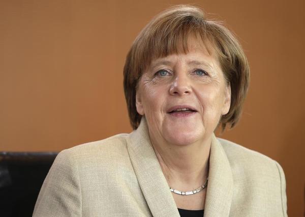 Merkel Stuck Defending a Bad Joke